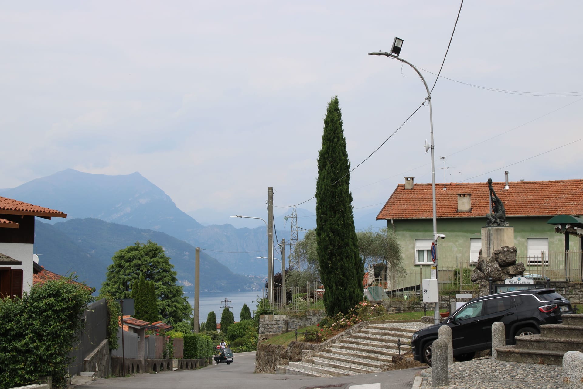A village street on Lake Como with mountains in the background